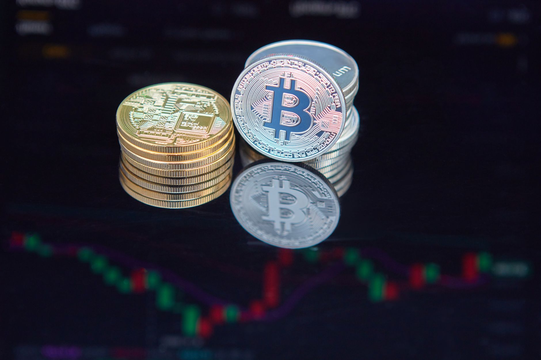 Bitcoin coins reflecting on a trading screen with financial market data, illustrating leveraged crypto ETF trading