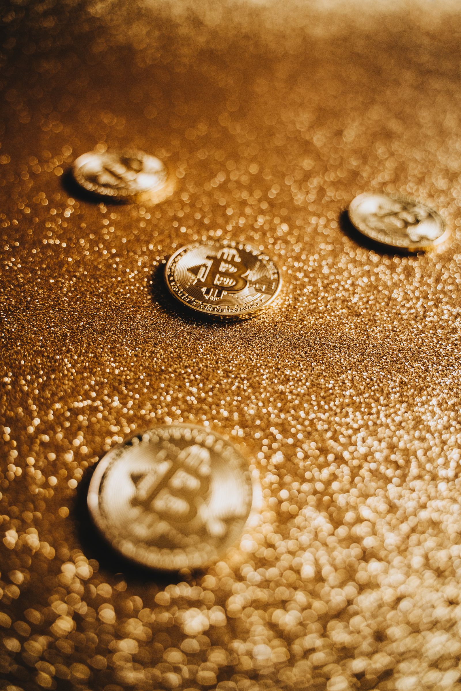Bitcoin coins on a gold background — the $80,000 debt-policy rally and the financial repression trade