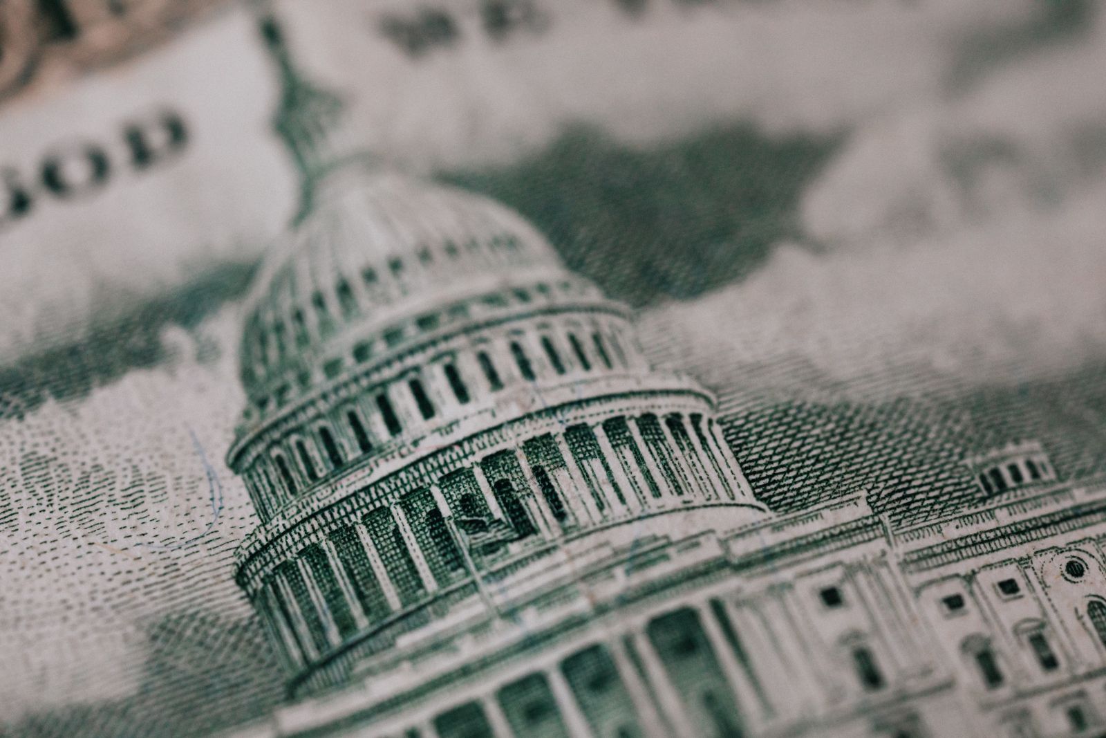 US Capitol building with American flag, representing GENIUS Act stablecoin regulation finalizing before the 2026 midterm elections